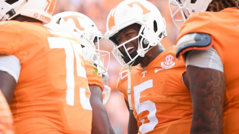 Tennessee quarterback Hendon Hooker congratulates Tennessee wide receiver Bru McCoy