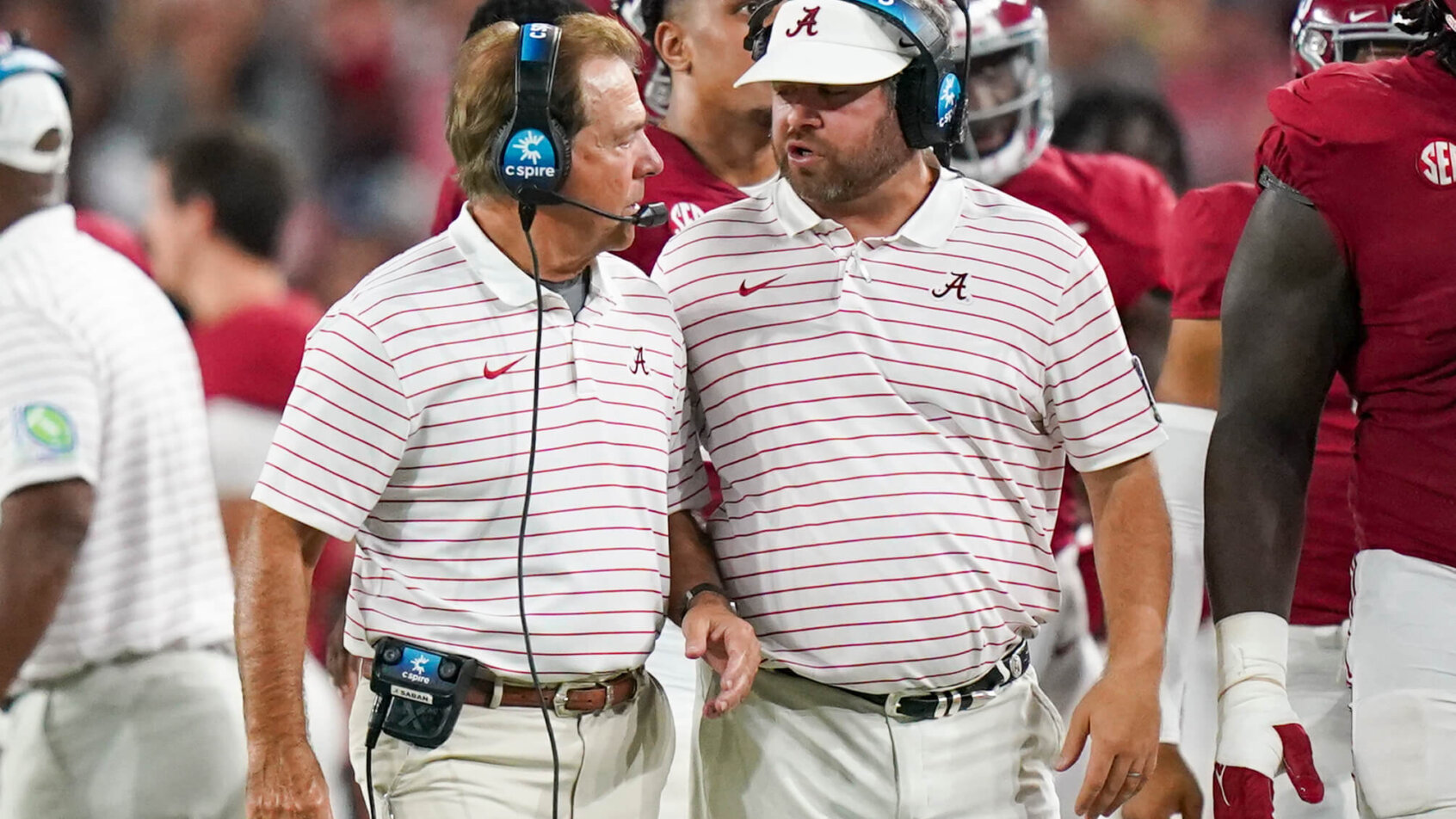 Alabama Crimson Tide head coach Nick Saban and defensive coordinator Pete Golding talking on the sideline