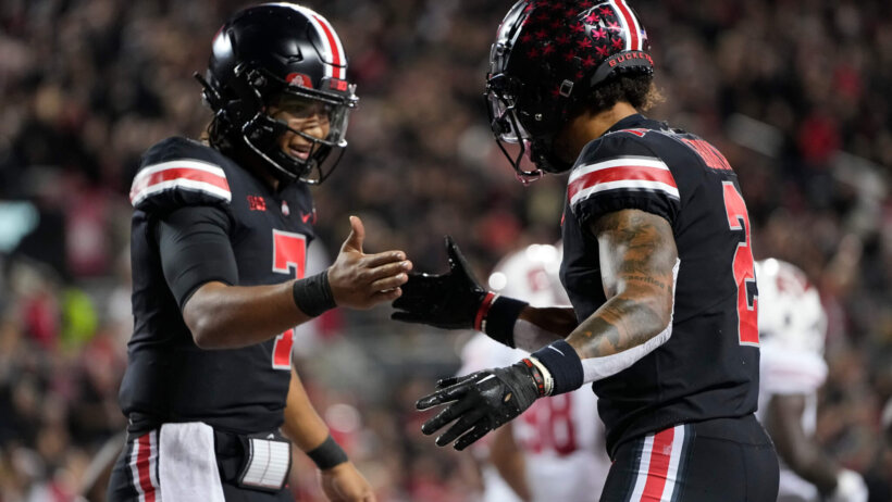 Ohio State Buckeyes quarterback C.J. Stroud celebrates a touchdown with wide receiver Emeka Egbuka
