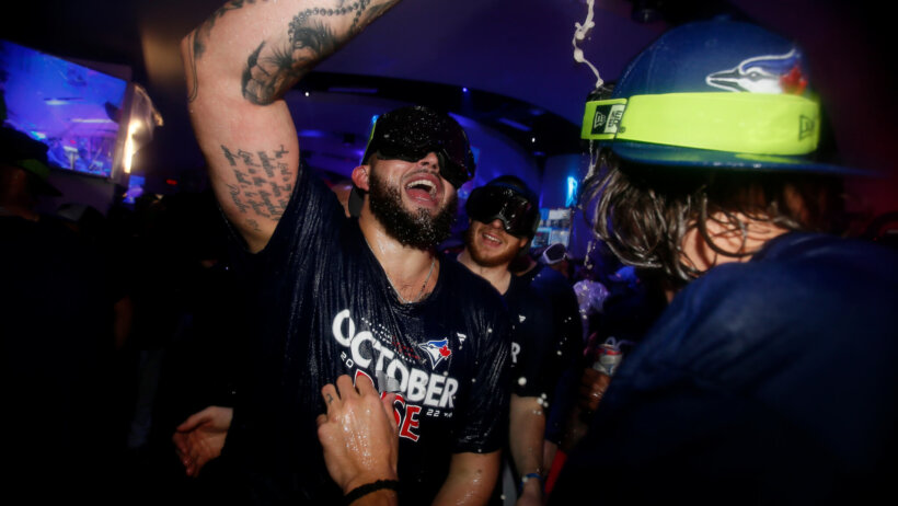 Toronto Blue Jays starting pitcher Alek Manoah celebrates his team's playoff berth