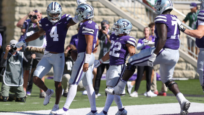 Kansas State Wildcats wide receiver Malik Knowles congratulates quarterback Adrian Martinez