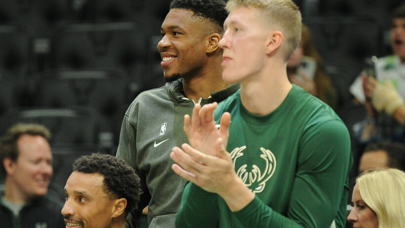 Milwaukee Bucks forward Giannis Antetokounmpo watches his team in street clothes against the Memphis Grizzlies