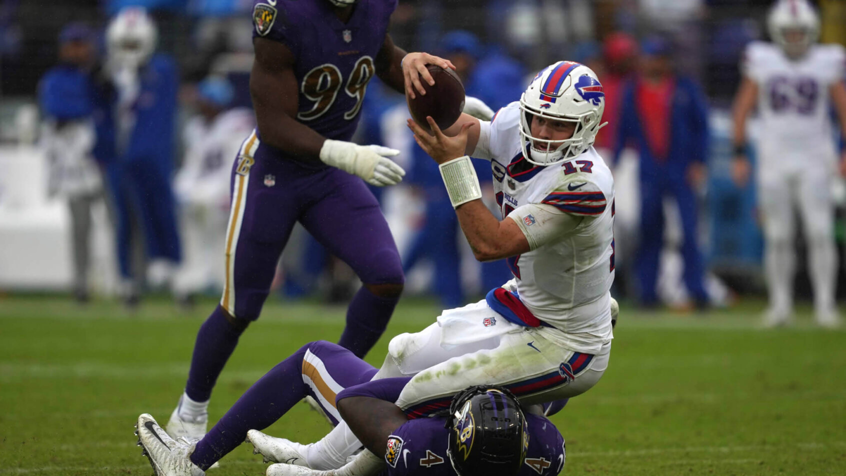 Buffalo Bills quarterback Josh Allen running with the ball against the Baltimore Ravens
