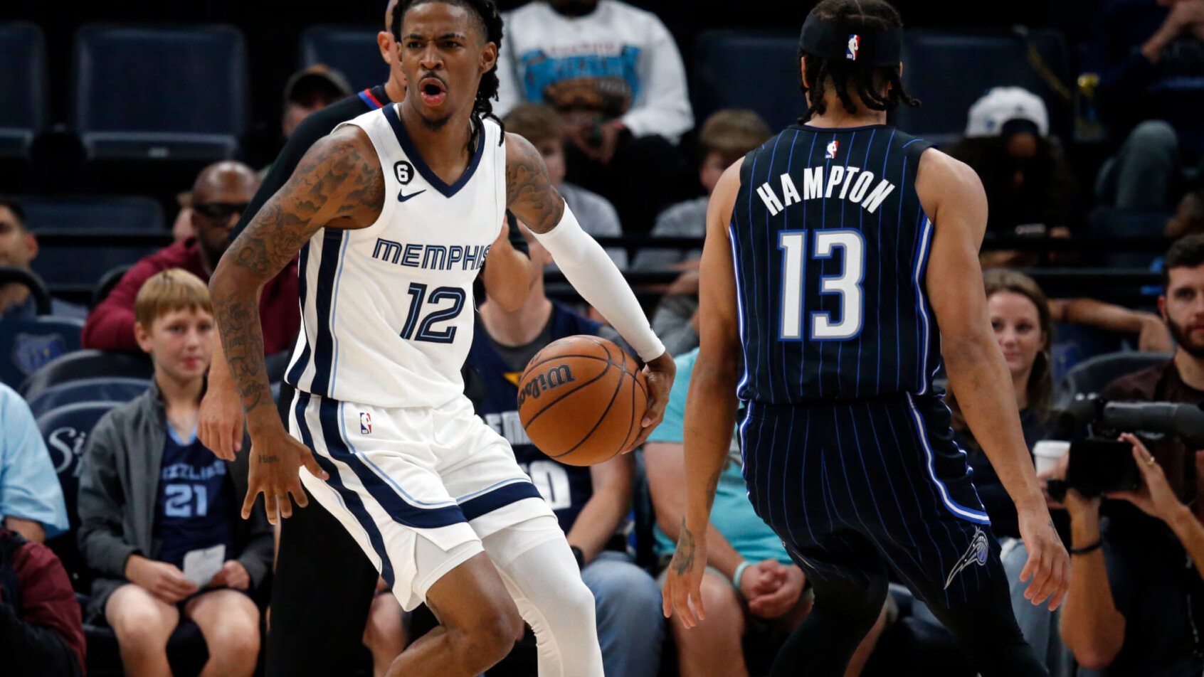 Memphis Grizzlies guard Ja Morant dribbling the ball up the court