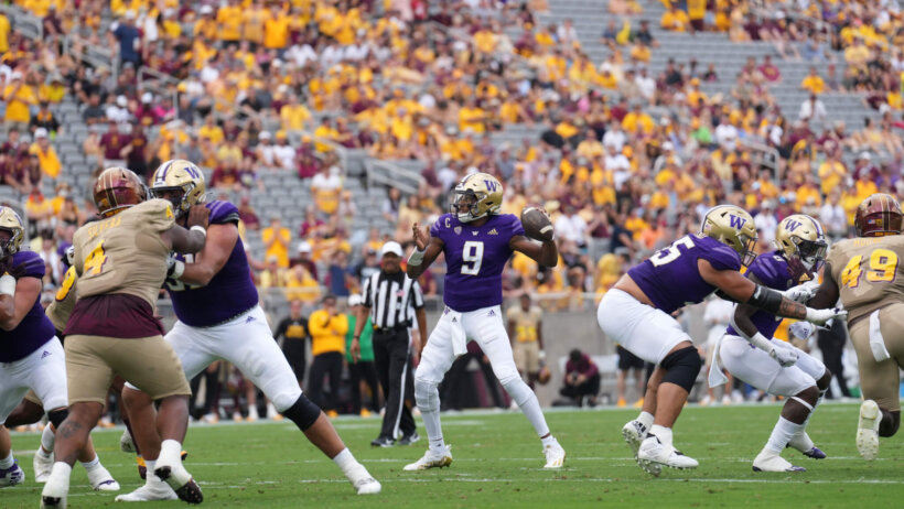 Washington Huskies quarterback Michael Penix Jr. throws a pass