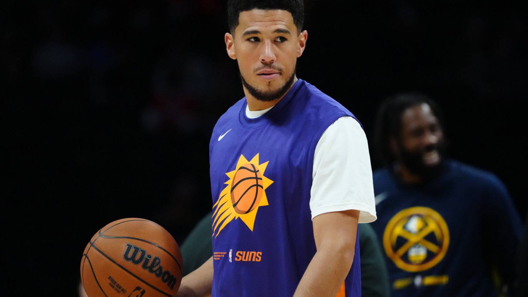 Phoenix Suns guard Devin Booker warming up