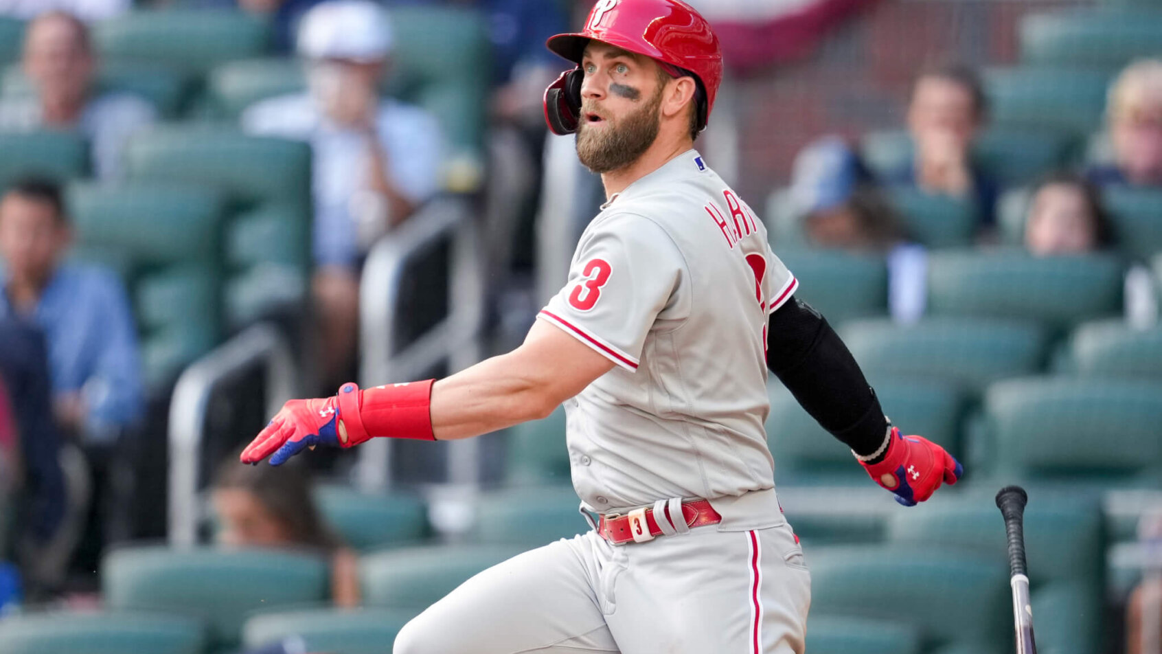Philadelphia Phillies designated hitter Bryce Harper watching the ball off his bat