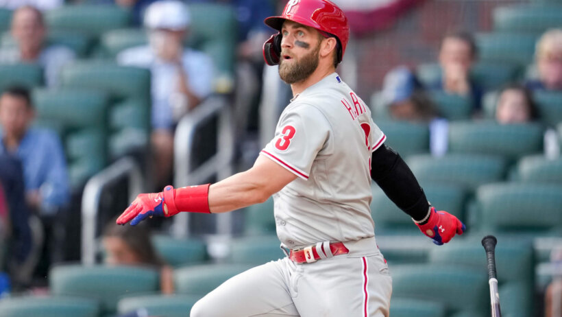 Philadelphia Phillies designated hitter Bryce Harper watching the ball off his bat