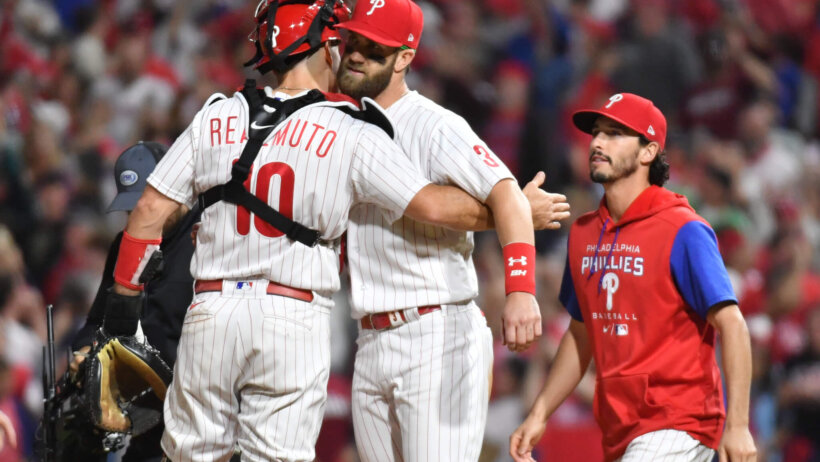 Philadelphia Phillies designated hitter Bryce Harper celebrates a win with catcher JT Realmuto