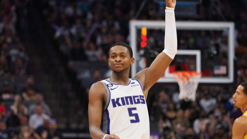 Sacramento Kings point guard De'Aaron Fox celebrates a three