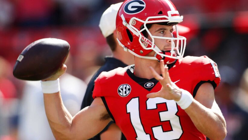 Georgia quarterback Stetson Bennett warms up before the start of a NCAA college football game