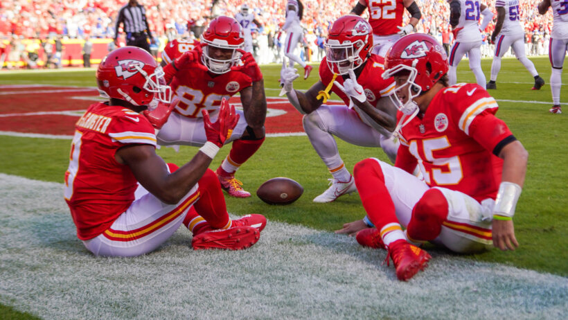 Kansas City Chiefs wide receiver JuJu Smith-Schuster and quarterback Patrick Mahomes and tight end Jody Fortson and running back Jerick McKinnon celebrate in the end zone