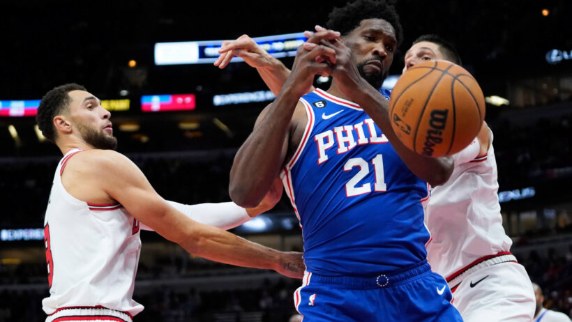 Philadelphia 76ers center Joel Embiid tries to corral a rebound
