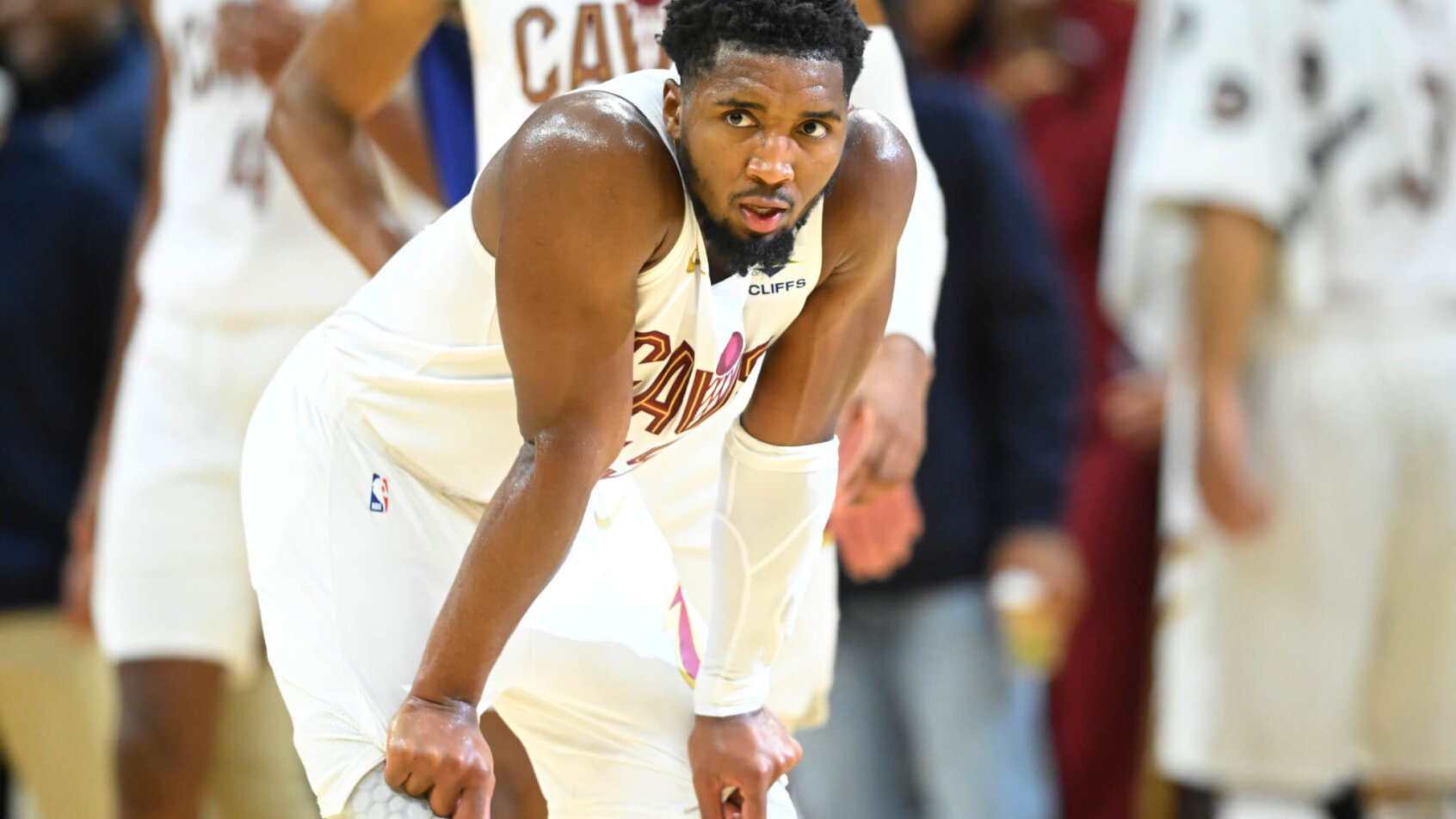 Cleveland Cavaliers guard Donovan Mitchell rests with his hands on his knees