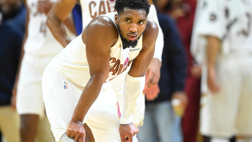 Cleveland Cavaliers guard Donovan Mitchell rests with his hands on his knees