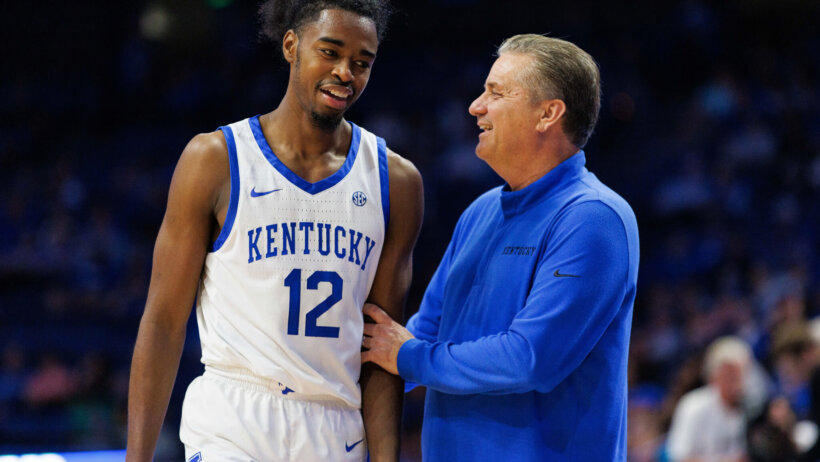 Kentucky Wildcats guard Antonio Reeves talks to coach John Calipari