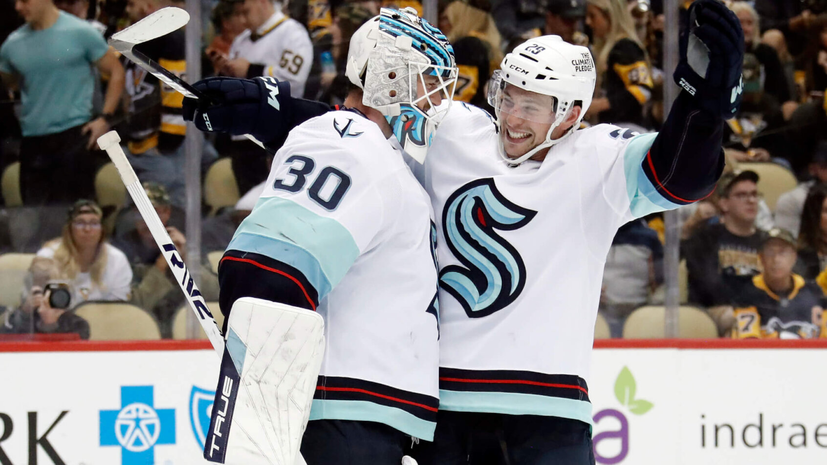 Seattle Kraken goaltender Martin Jones (30) and defenseman Vince Dunn celebrate