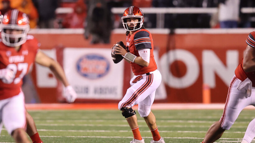 Utah Utes quarterback Cameron Rising looks to pass the ball