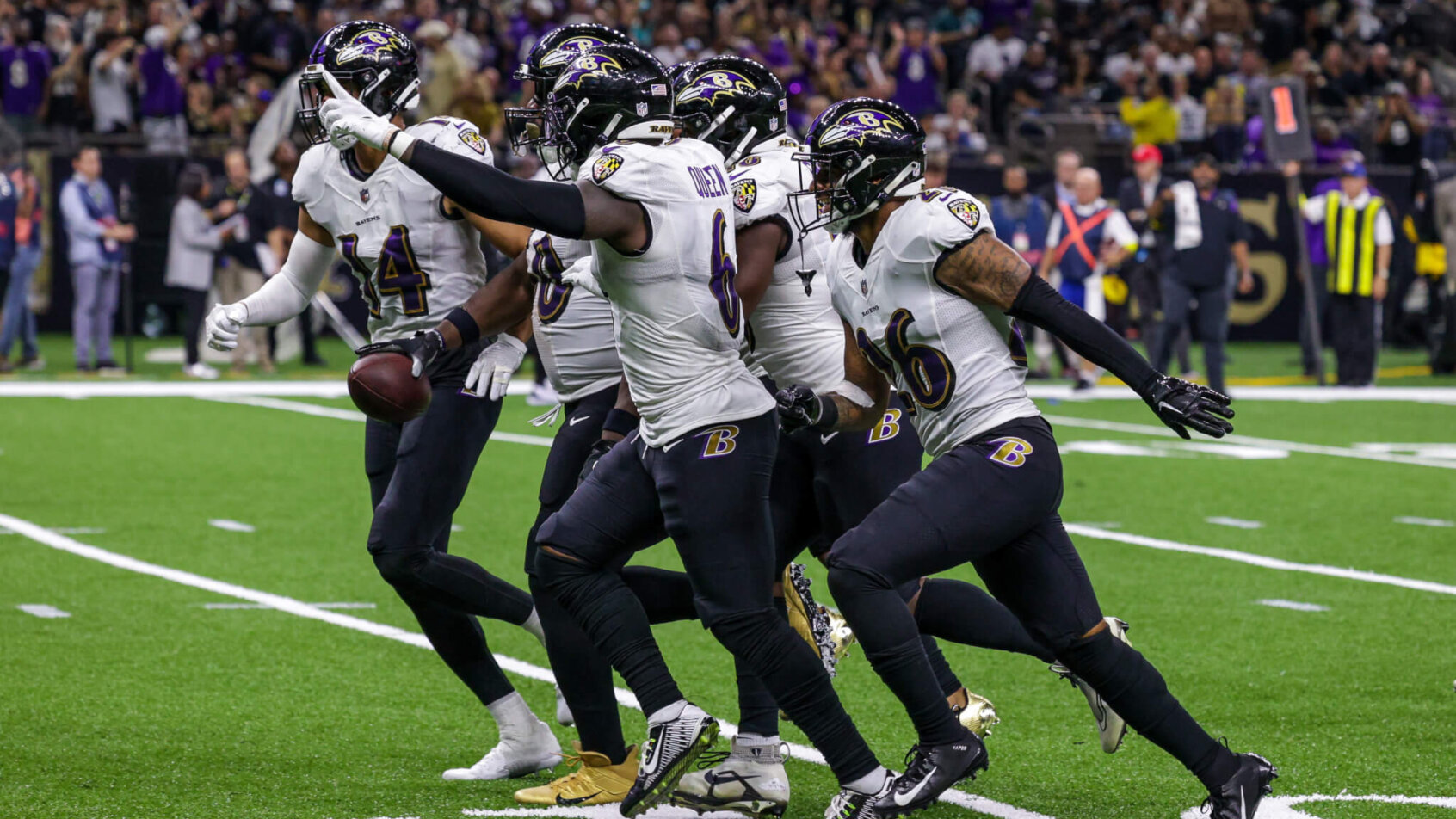 Baltimore Ravens players celebrating interception