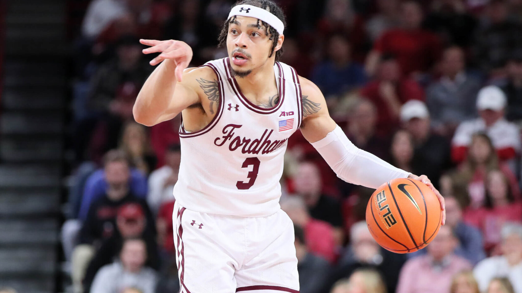Darius Quisenberry bring ball up court; Fordham Rams