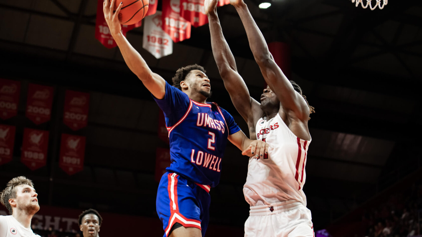 UMass Lowell River Hawks guard Ayinde Hikim rises for a layup