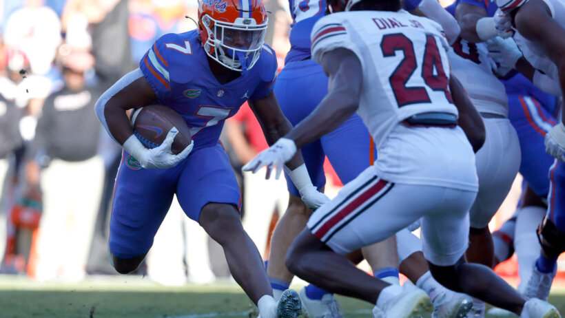 Florida Gators running back Trevor Etienne runs with the ball