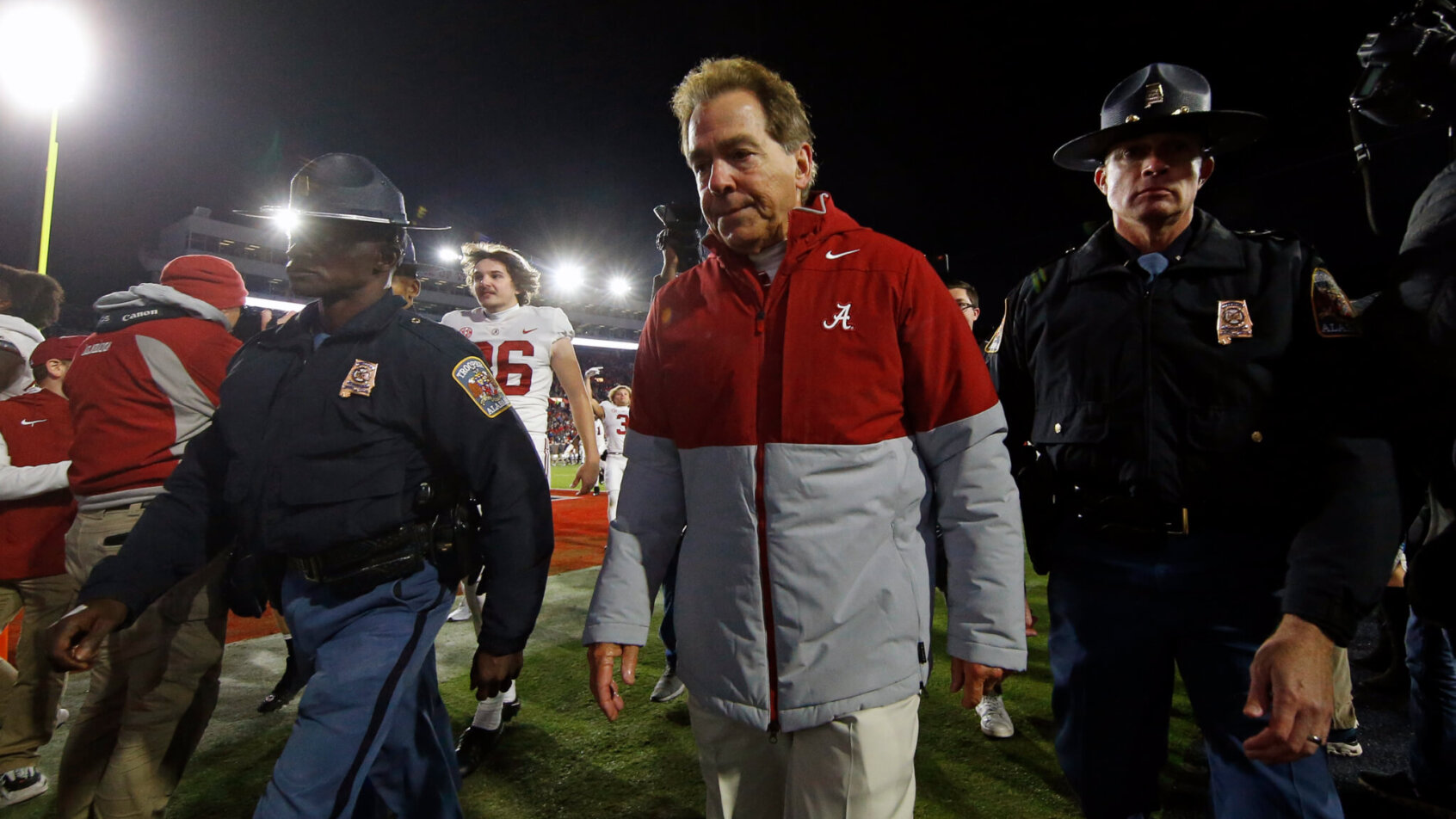 Nick Saban walks off the field