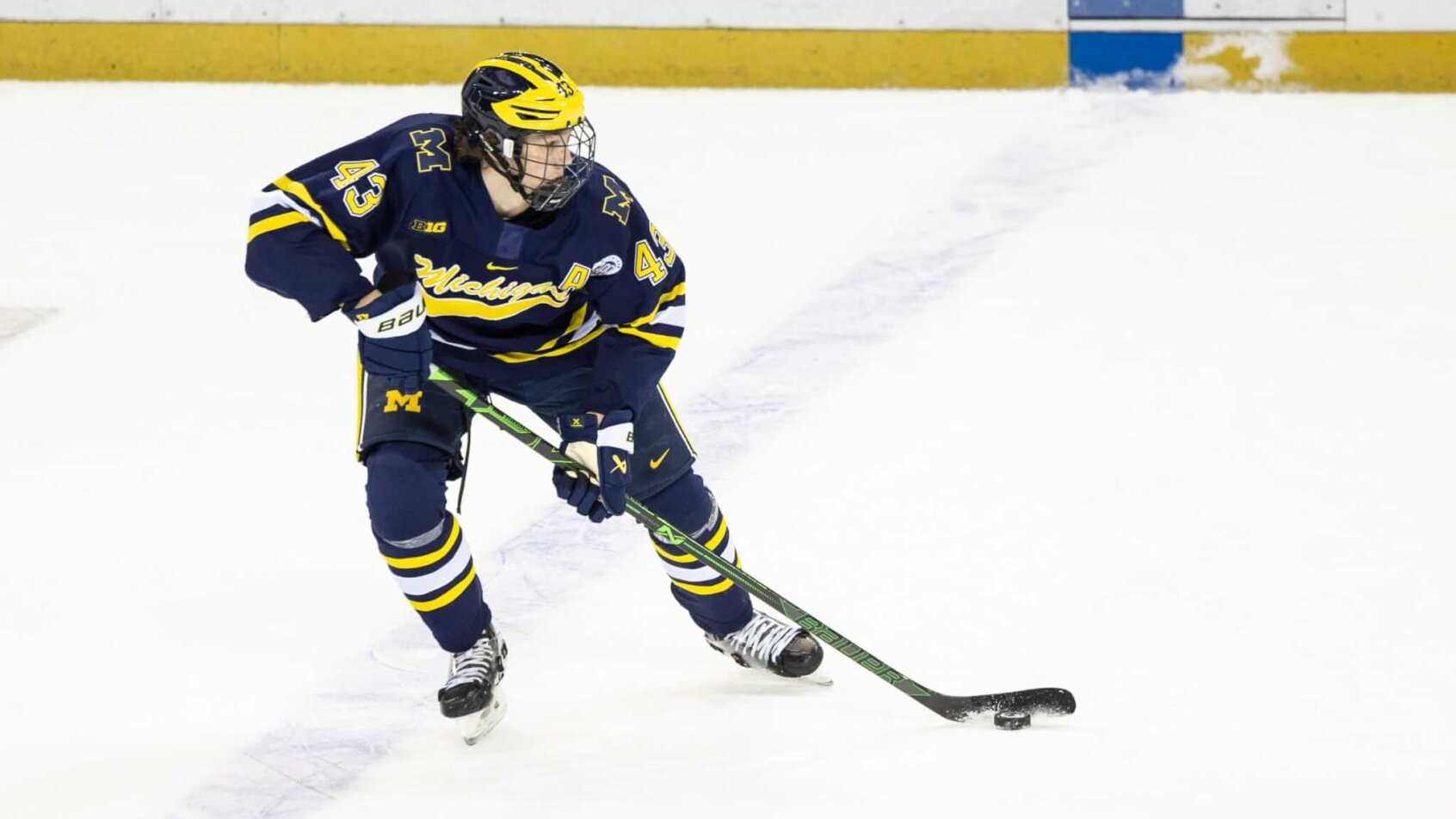 Team USA defenseman Luke Hughes skates with the puck