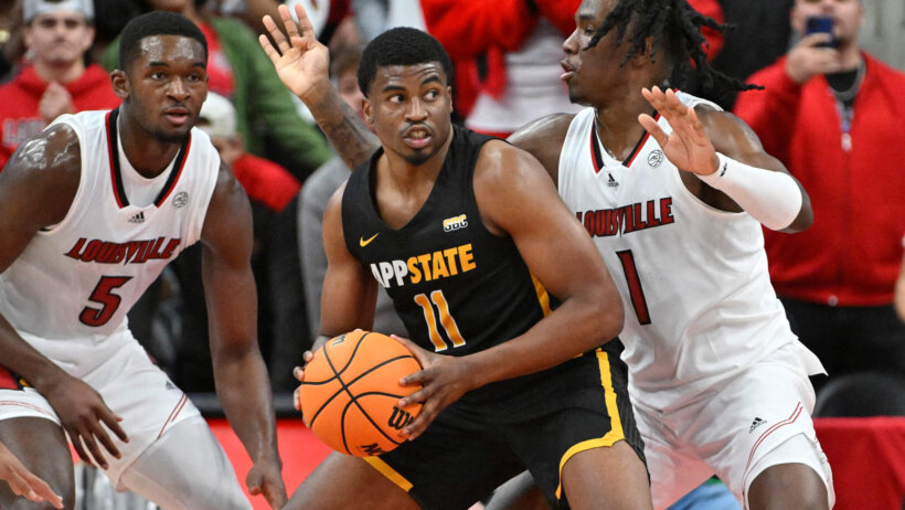 Appalachian State Mountaineers forward Donovan Gregory posts up a defender
