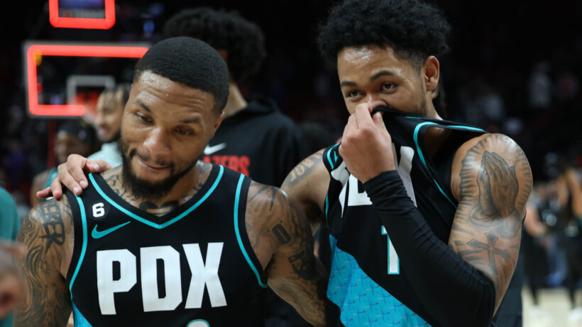 Portland Trail Blazers guard Damian Lillard aand guard Anfernee Simons celebrating a win
