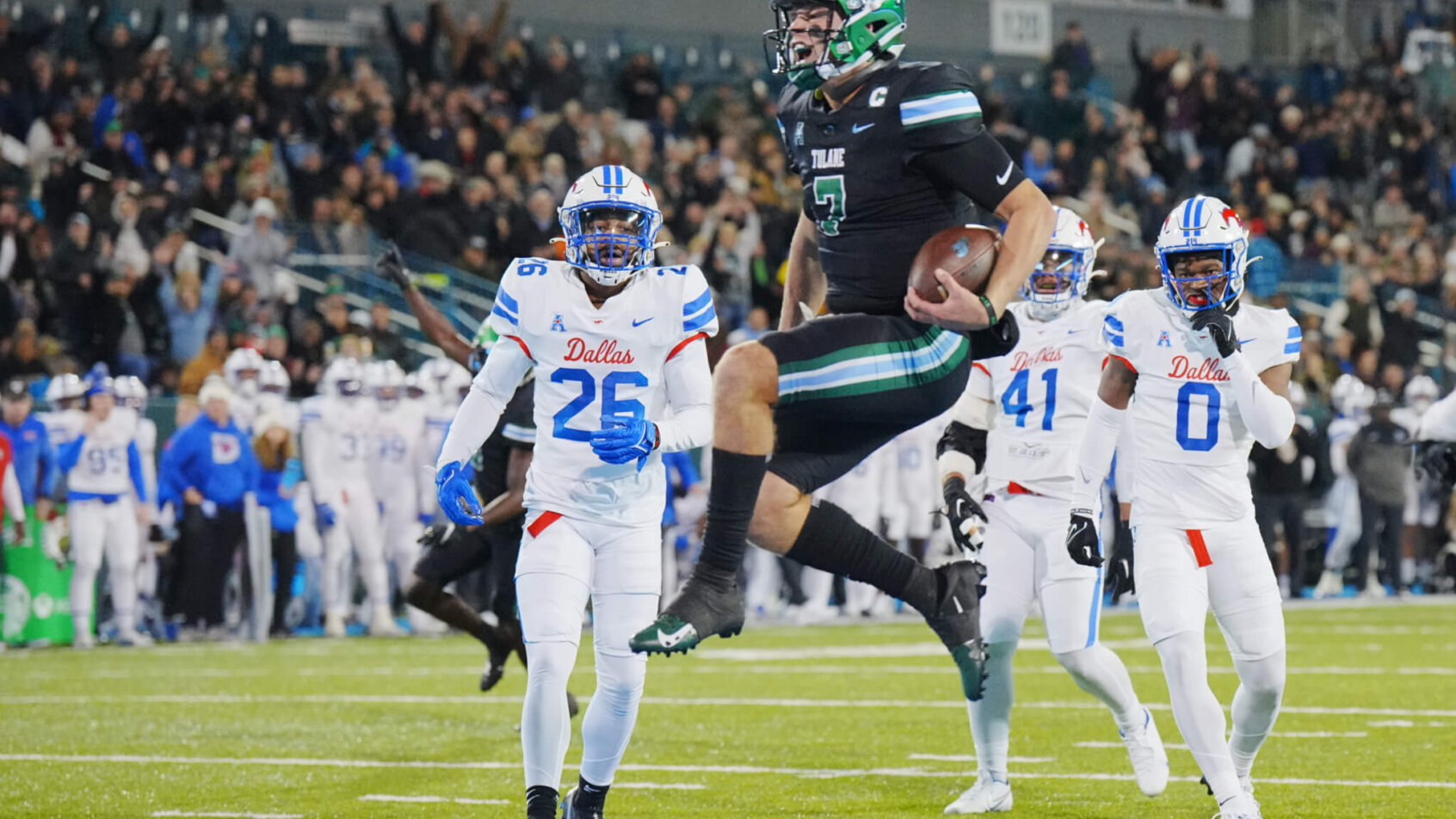 Tulane Green Wave quarterback Michael Pratt jumps into the Endzone