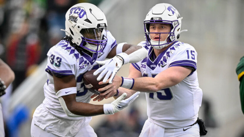 TCU Horned Frogs quarterback Max Duggan hands off the ball