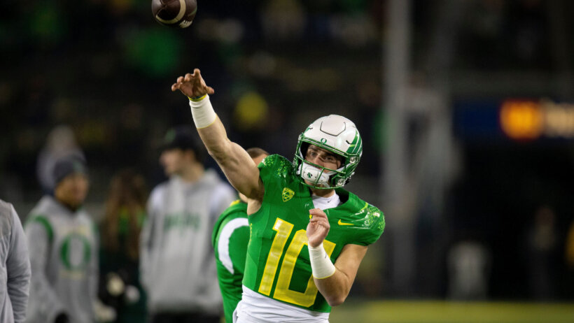 Oregon quarterback Bo Nix throws out a pass
