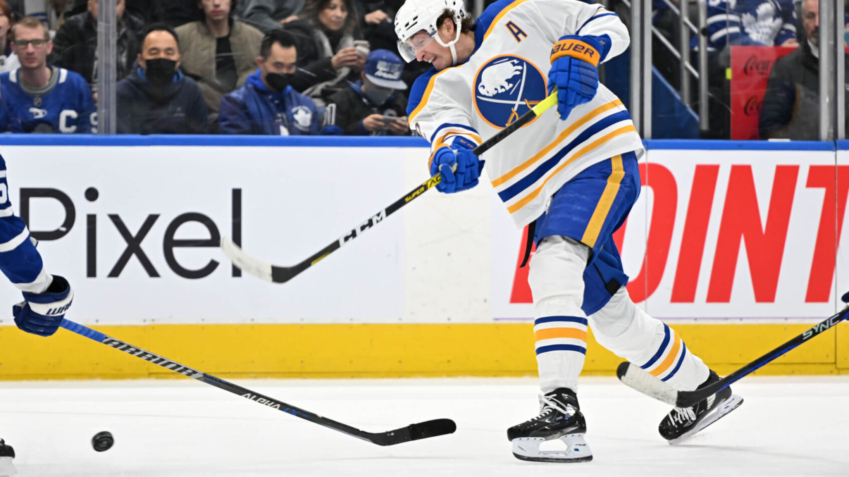 Buffalo Sabres forward Tage Thompson shoots the puck