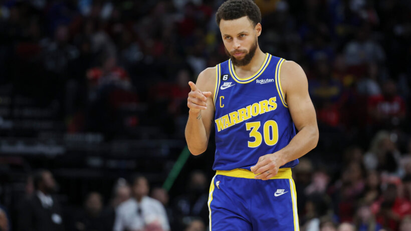 Golden State Warriors guard Stephen Curry pointing