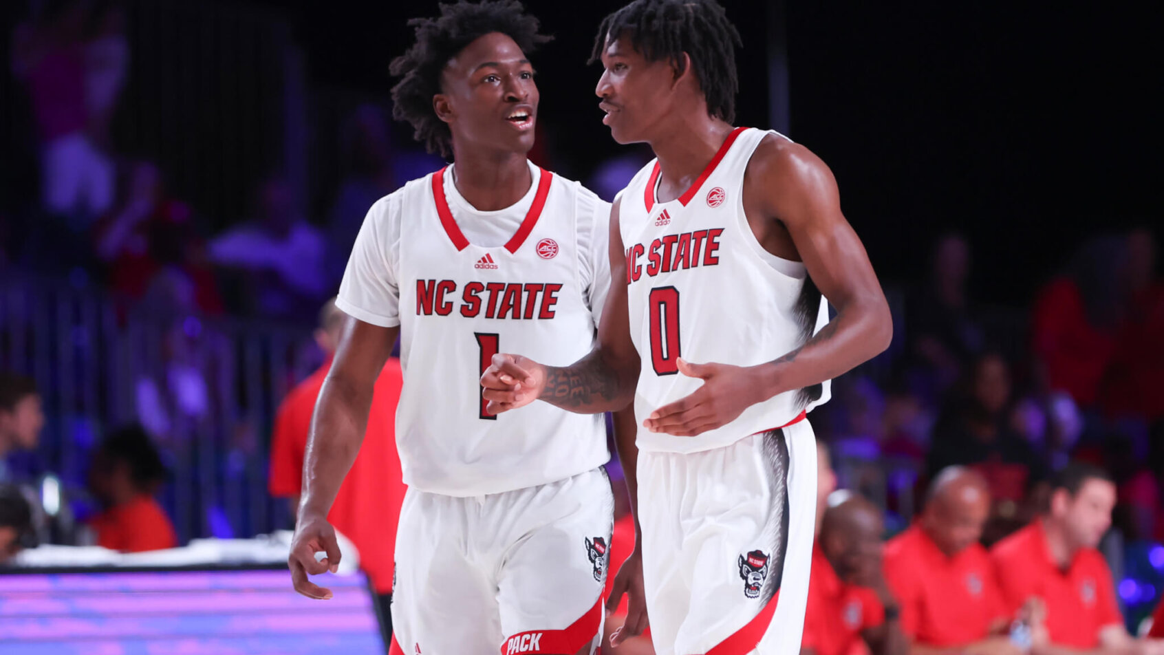 North Carolina State Wolfpack guards Jarkel Joiner and Terquavion Smith talking on the court