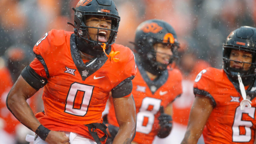 Oklahoma State Cowboys running back Ollie Gordon celebrates