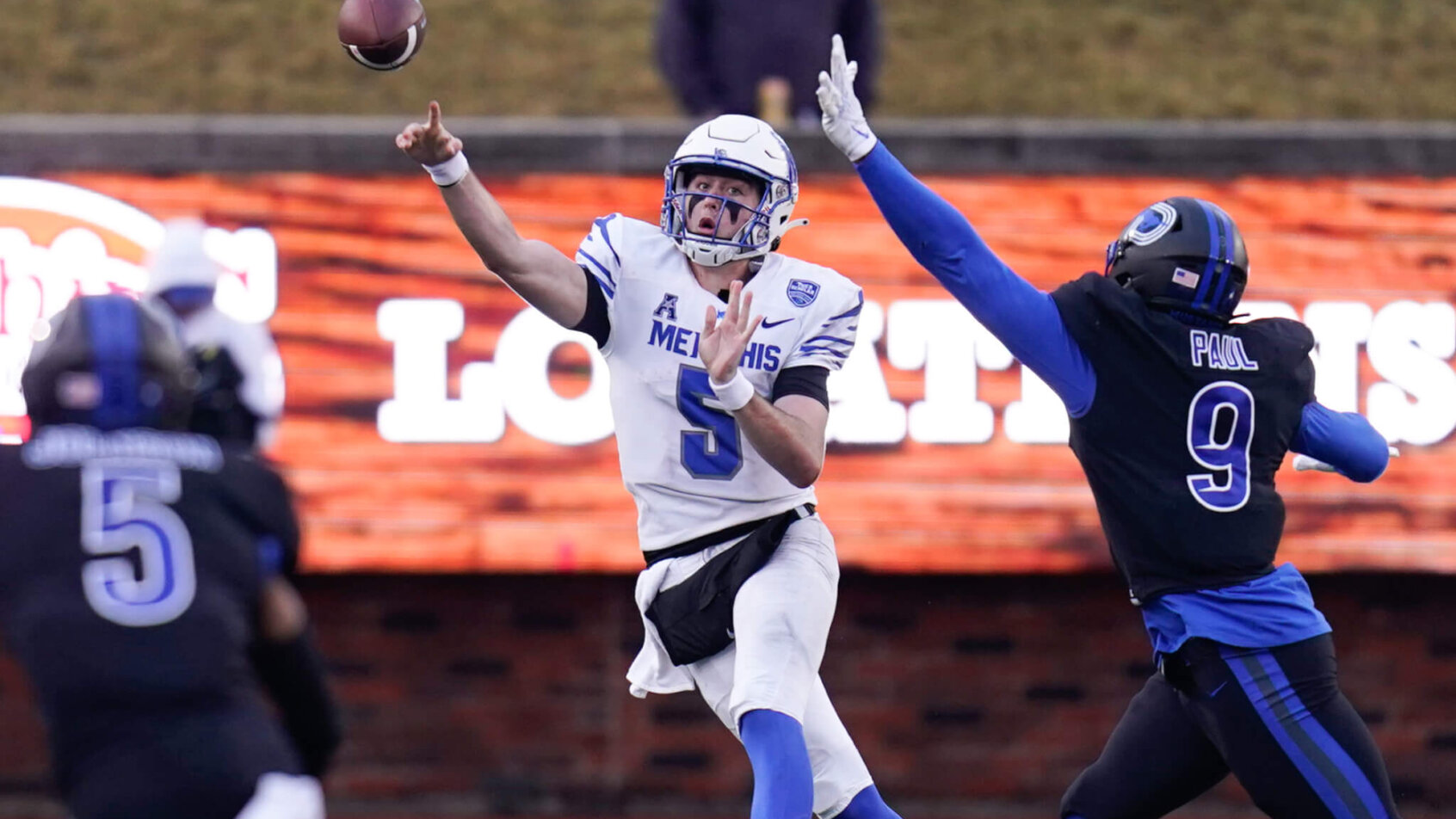 Memphis Tigers quarterback Seth Henigan passes the ball