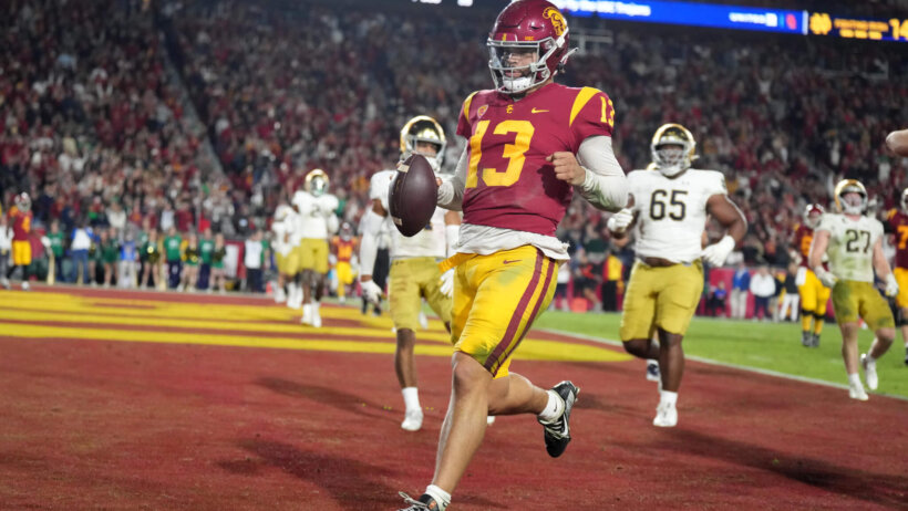 USC quarterback Caleb Williams scores a touchdown
