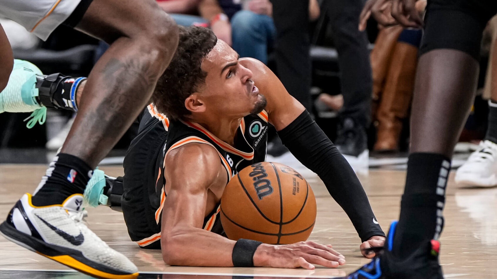 Atlanta Hawks guard Trae Young diving for a loose ball