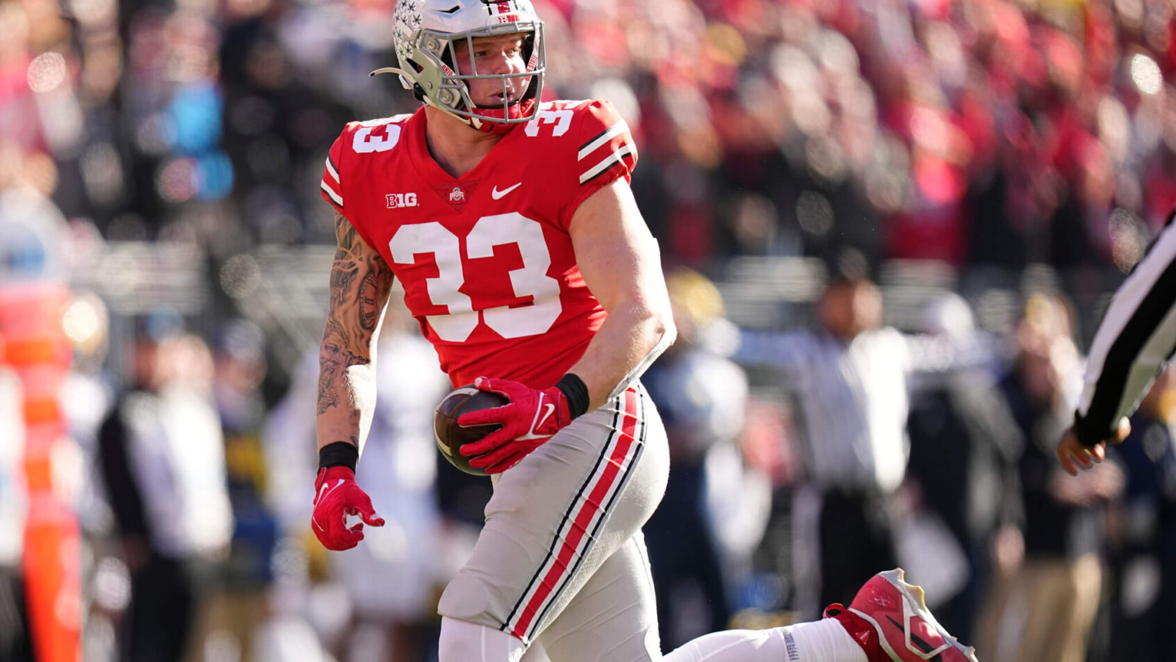 Ohio State Buckeyes player recovers fumble red jersey