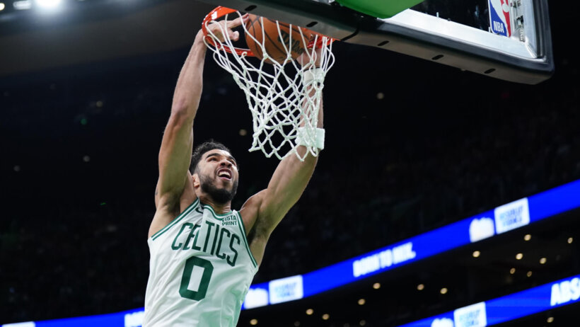 Boston Celtics forward Jayson Tatum dunking