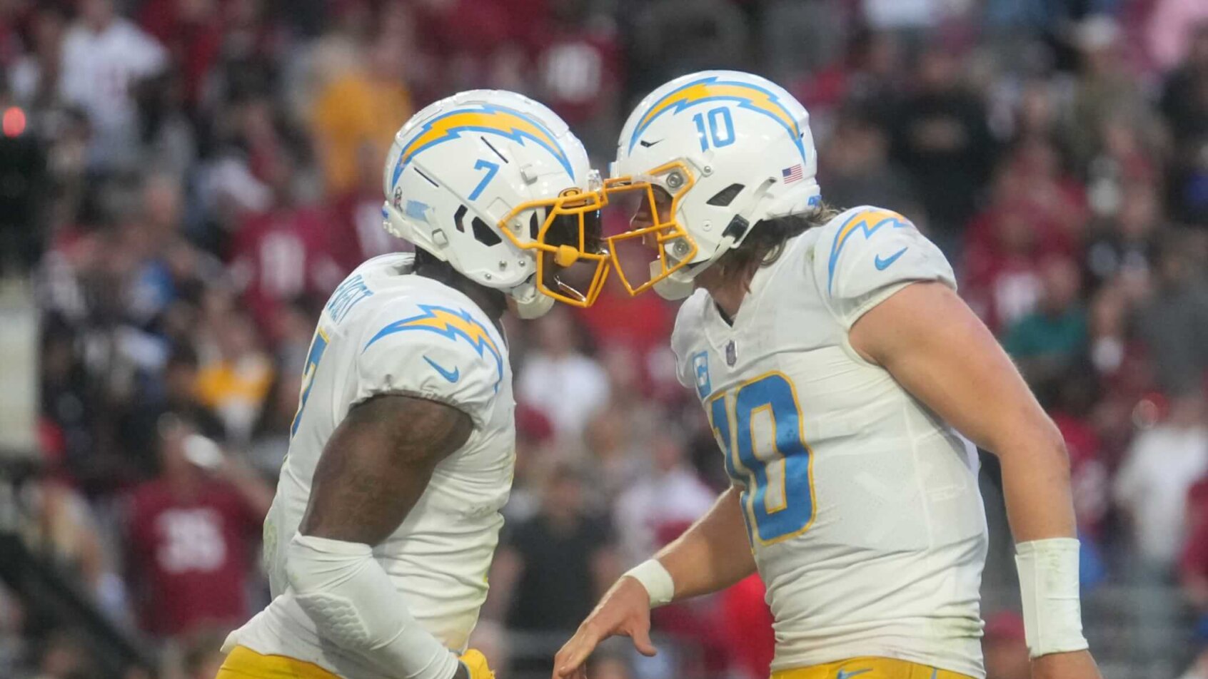 LA Chargers players Justin Herbert and Gerald Everett celebrate