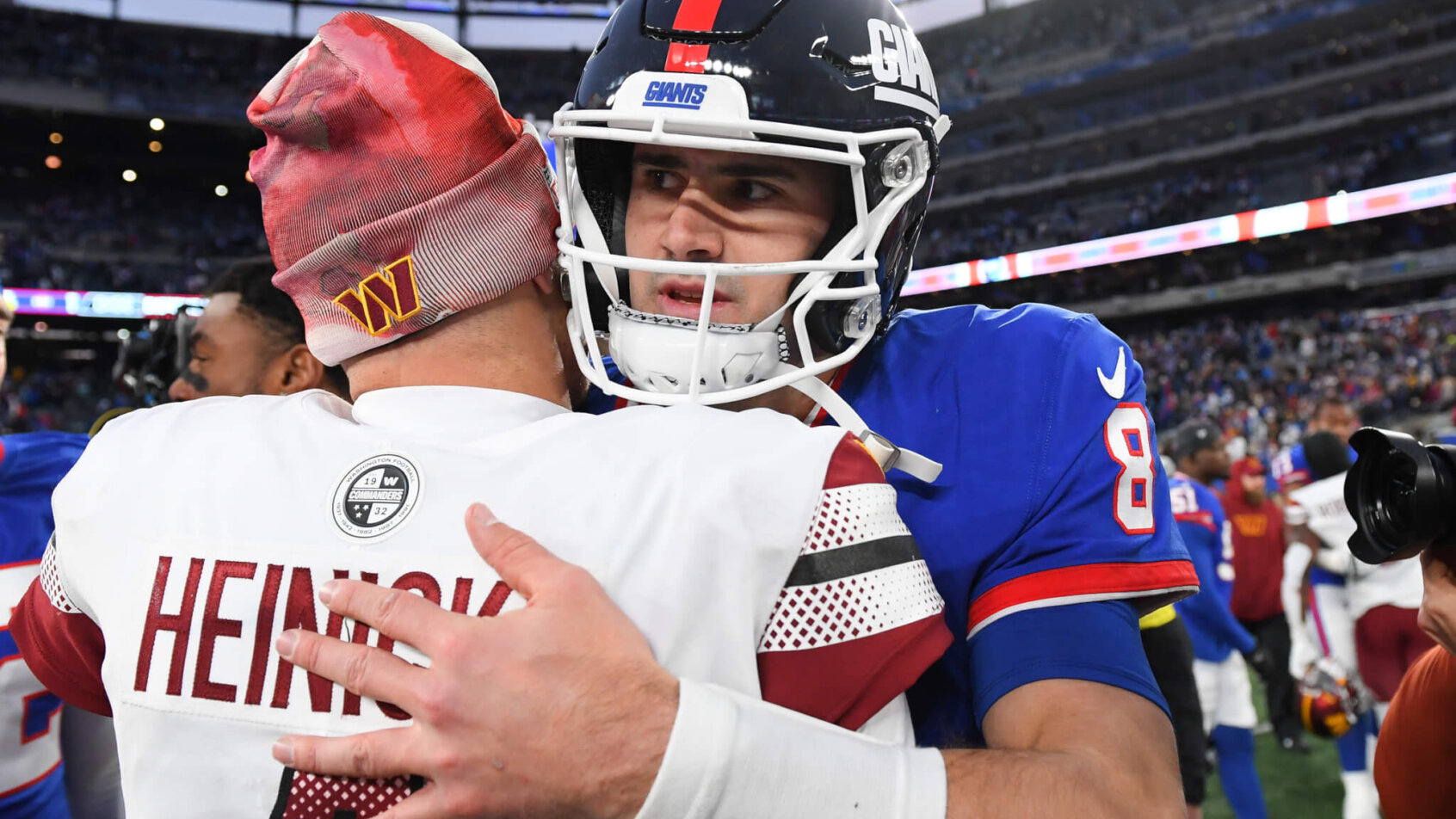 Heinicke and Jones hug