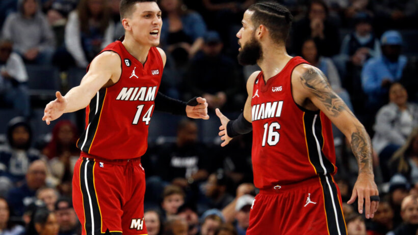 Miami Heat guard Tyler Herro forward Caleb Martin high fiving