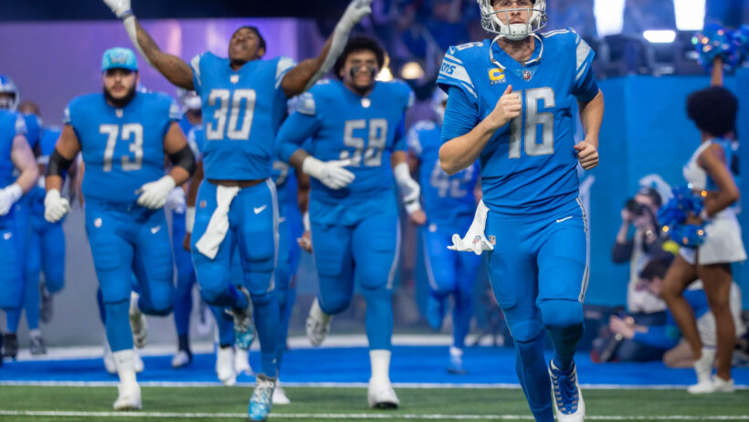 Detroit Lions quarterback Jared Goff runs onto the field