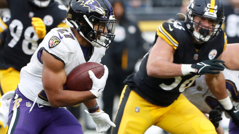 Baltimore Ravens running back J.K. Dobbins runs the ball