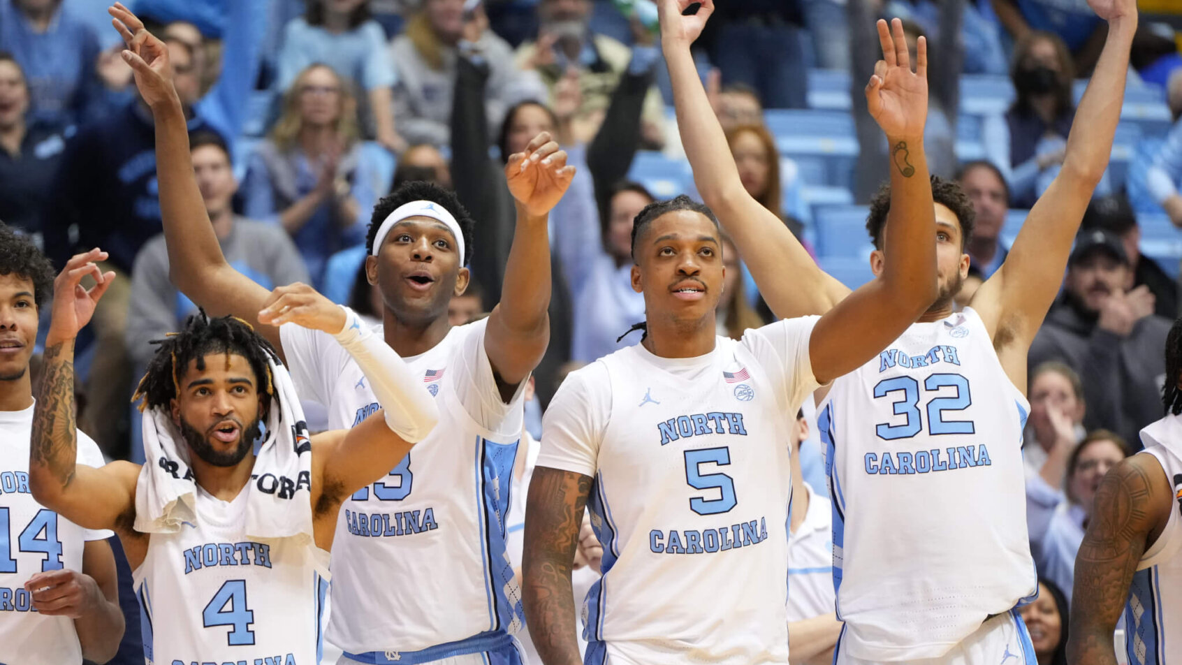 UNC players celebrating a three.