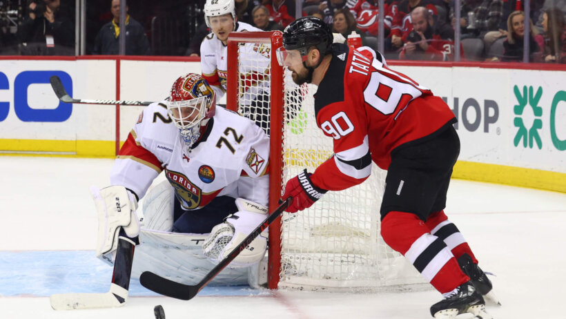 New Jersey Devils left wing Tomas Tatar plays the puck against Florida Panthers goaltender Sergei Bobrovsky
