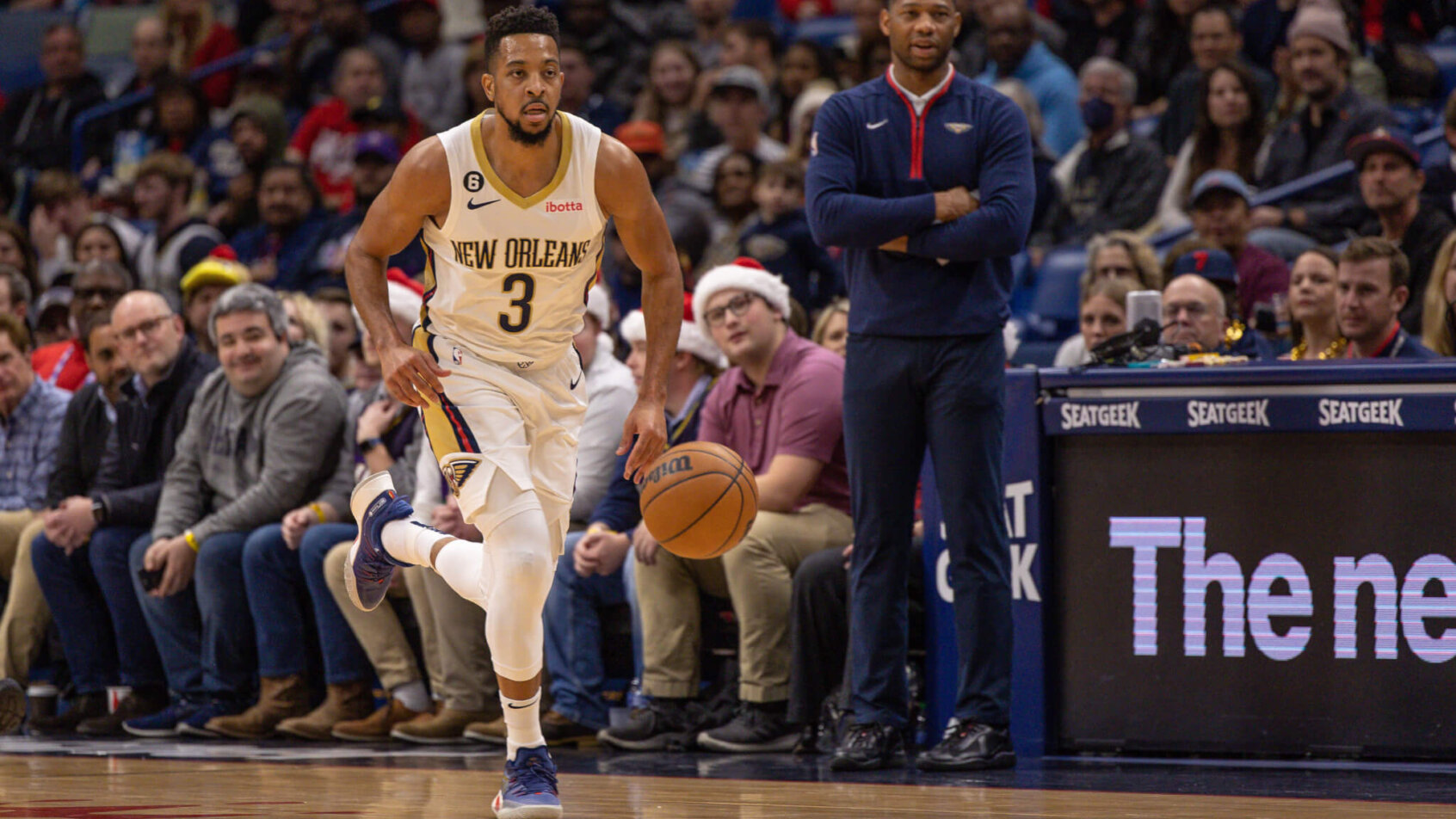 New Orleans Pelicans guard CJ McCollum dribbling up the court